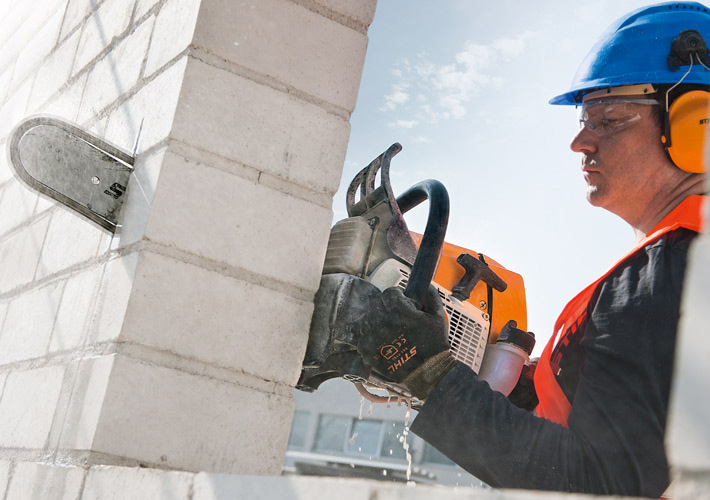 Diamond Chainsaw blade on Stihl Chainsaw cutting through cinderblock