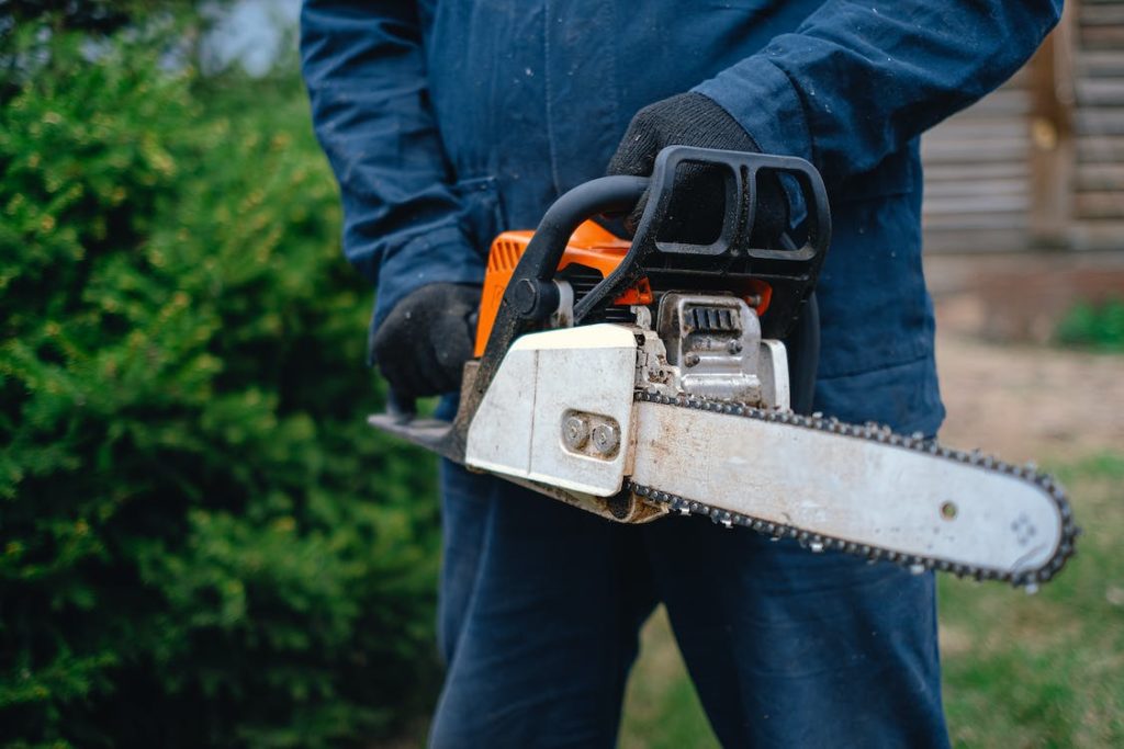 A man holding a chainsaw